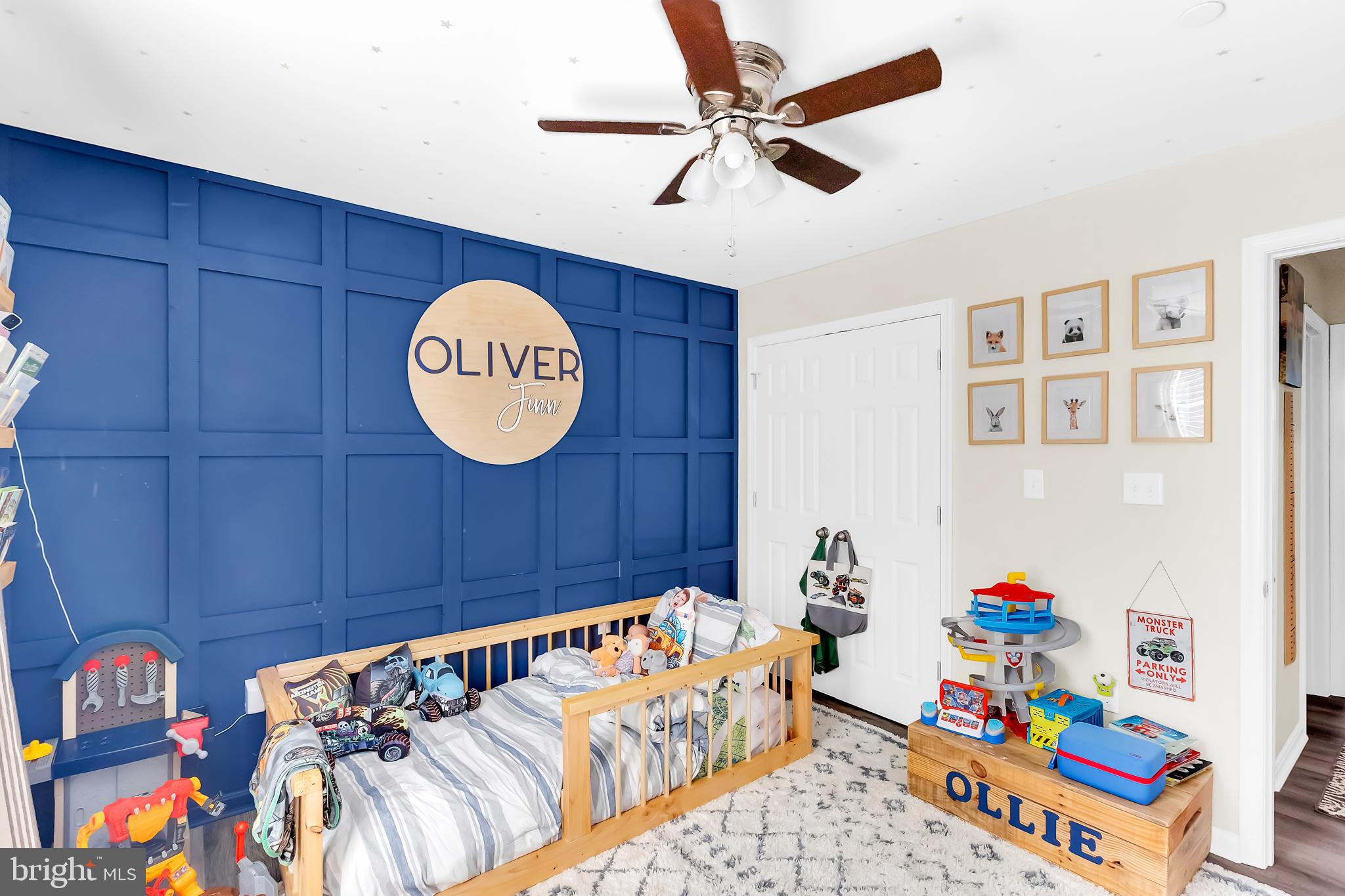 7829 New Hope Road Willards, MD 21874 - Photo 18 of 41 a bedroom with a bed and a chandelier