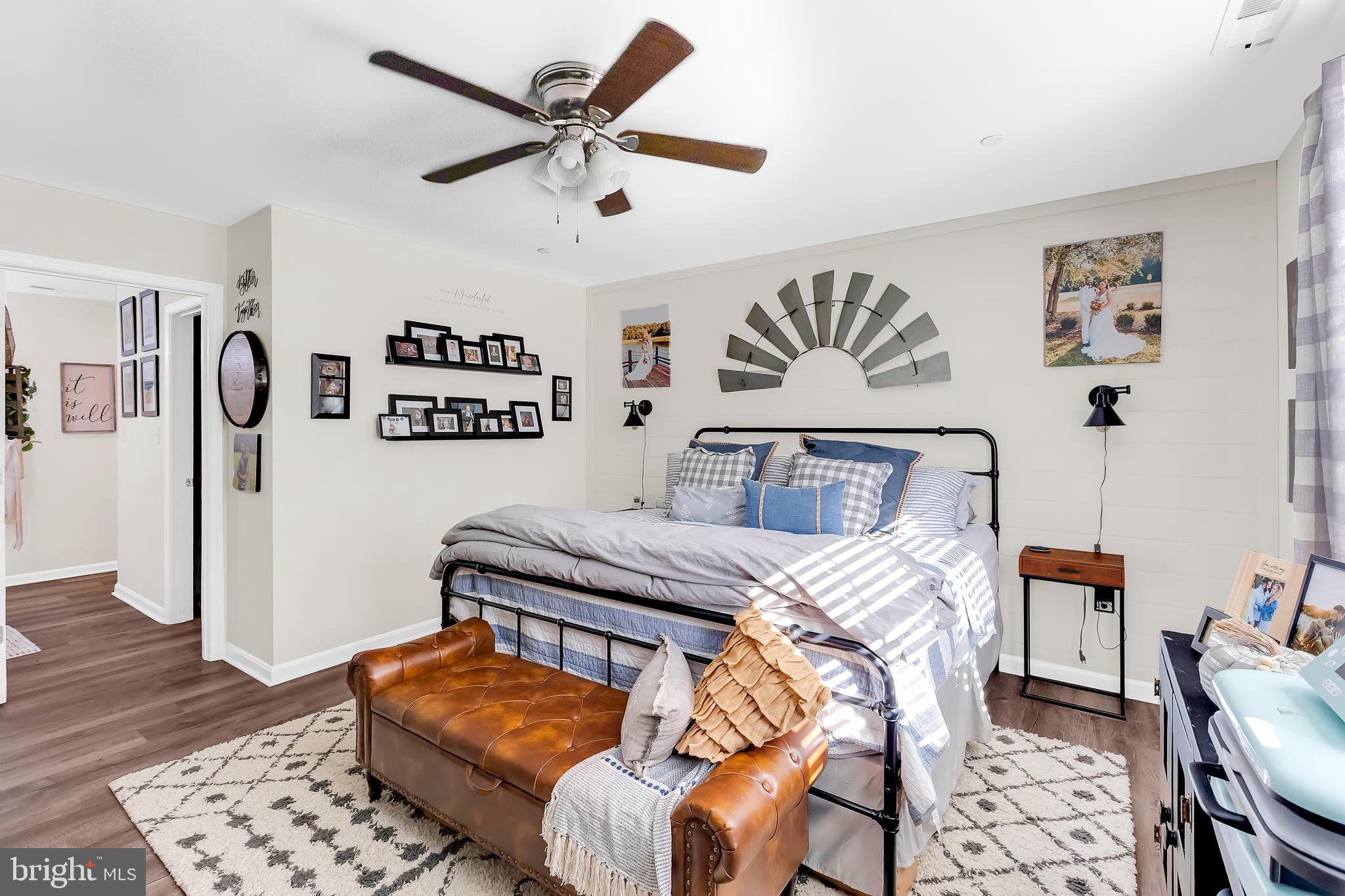 7829 New Hope Road Willards, MD 21874 - Photo 25 of 41 a bedroom with furniture and wooden floor