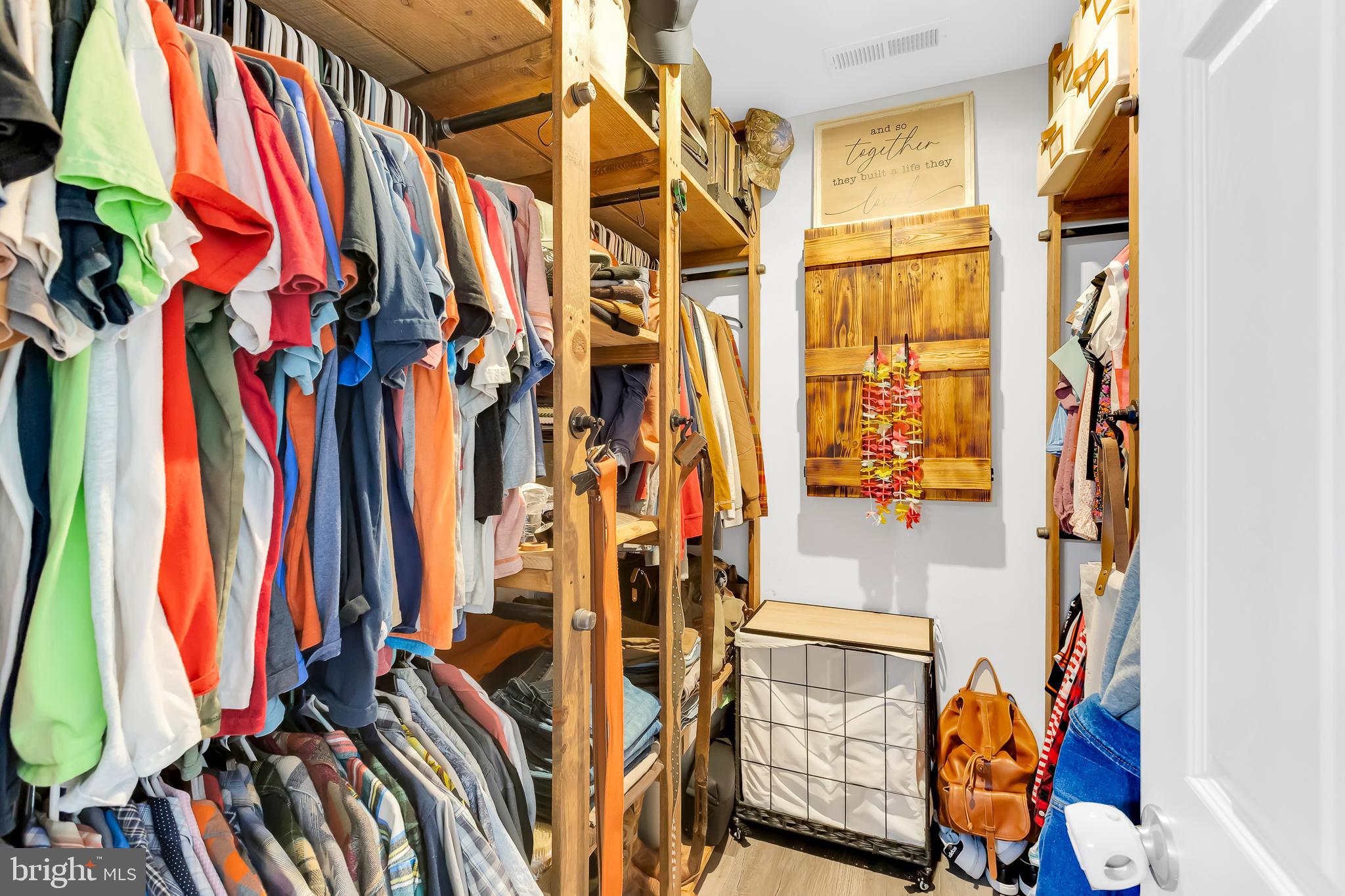 7829 New Hope Road Willards, MD 21874 - Photo 26 of 41 a view of walk in closet with clothes and shoes
