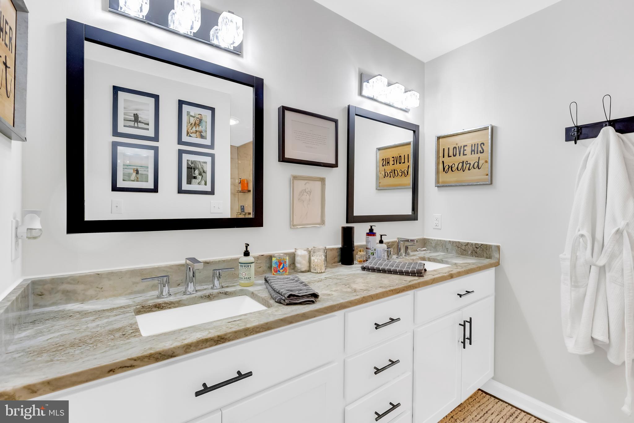 7829 New Hope Road Willards, MD 21874 - Photo 28 of 41 a bathroom with double sink and a mirror