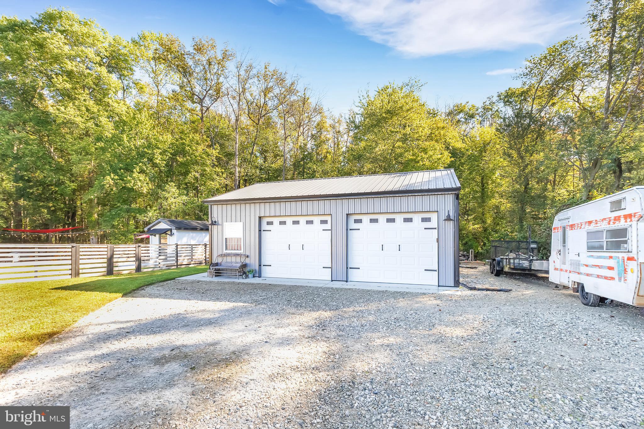 7829 New Hope Road Willards, MD 21874 - Photo 41 of 41 a view of a house with a backyard and a tree