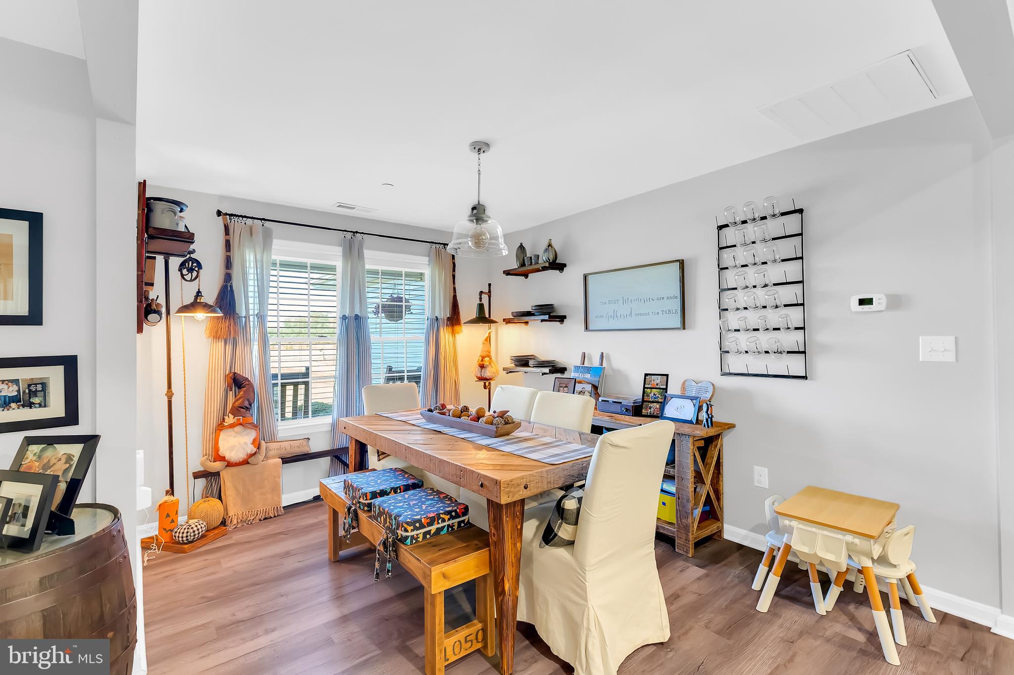 7829 New Hope Road Willards, MD 21874 - Photo 7 of 41 a dining room with a wooden table and chairs