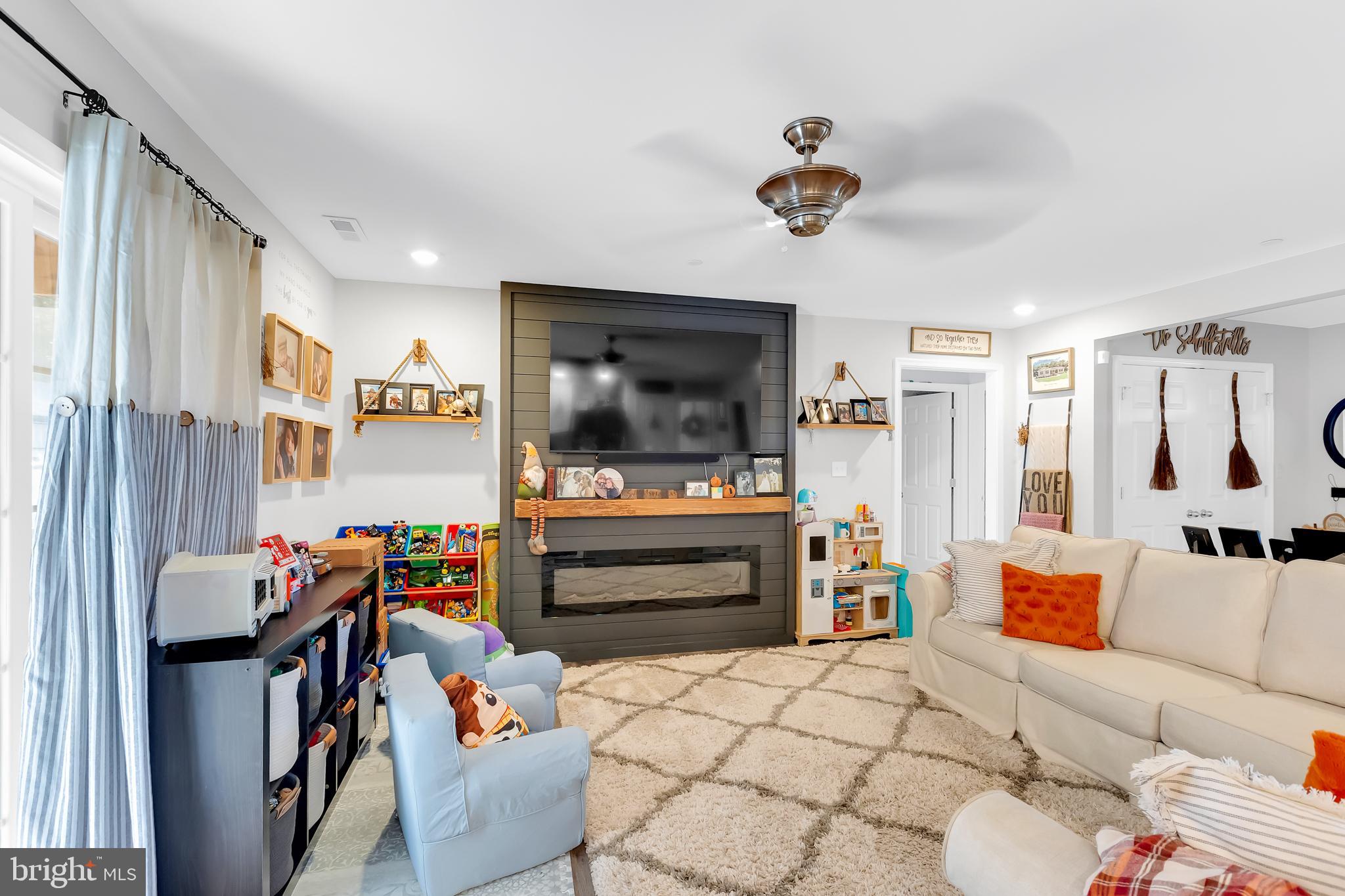 7829 New Hope Road Willards, MD 21874 - Photo 10 of 41 a living room with furniture and a flat screen tv