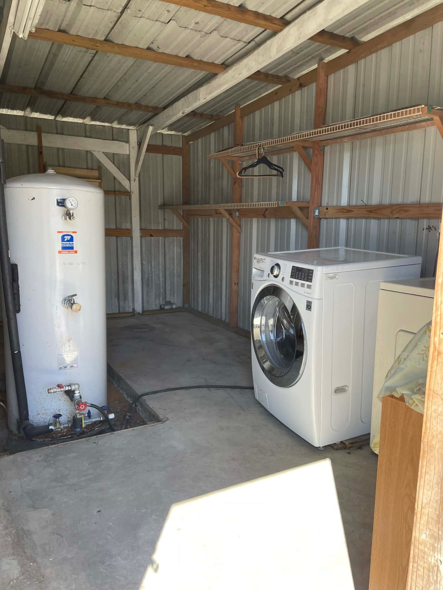 1825 Isom Street Houston, TX 77039 - Photo 26 of 27 a utility room with dryer and washer
