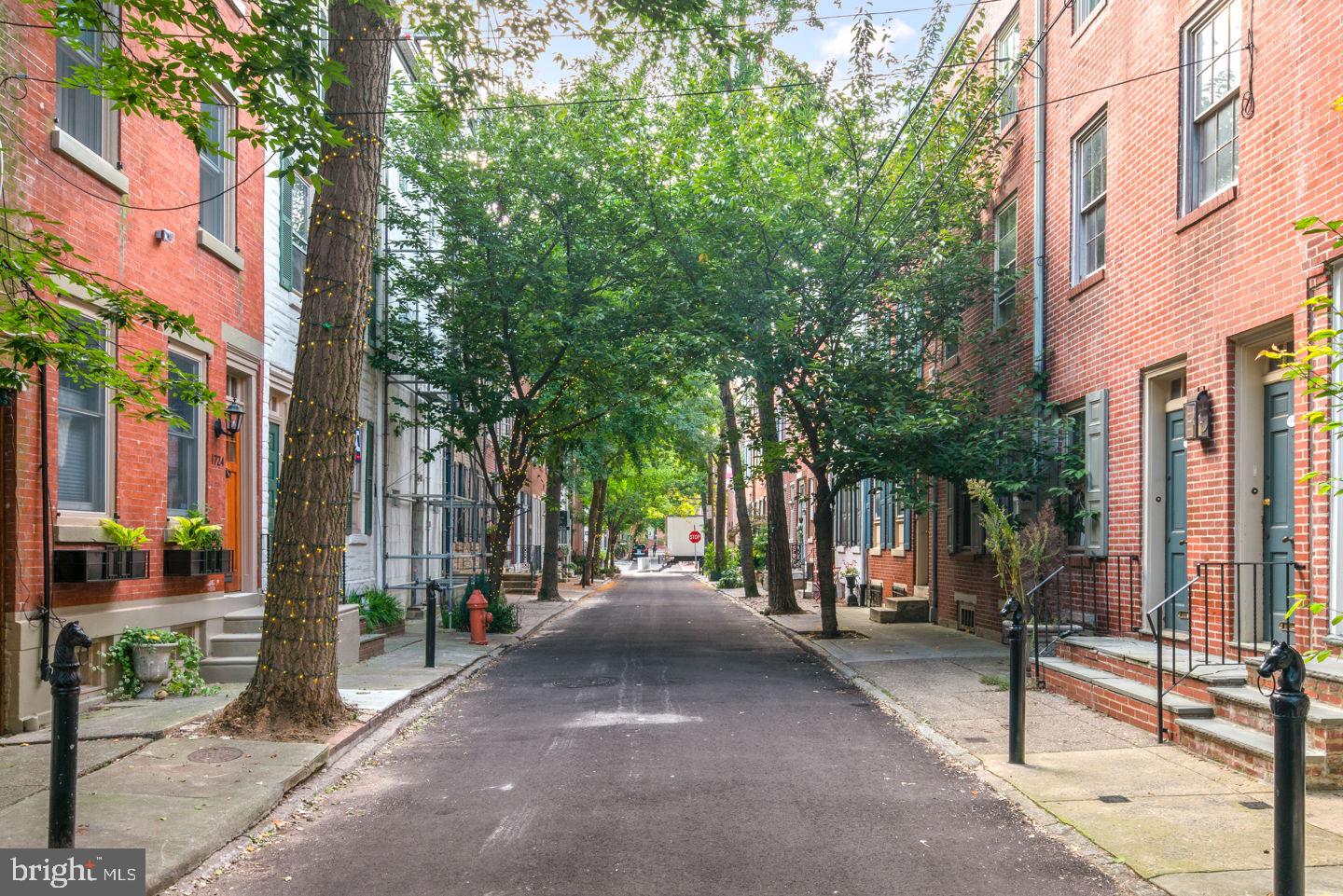 a view of a street with sitting area