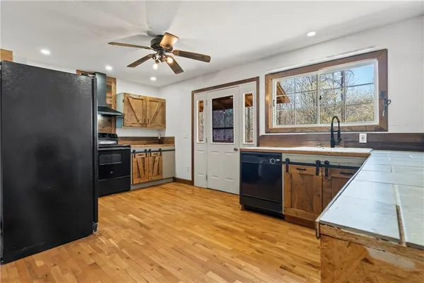 a bathroom with a sink mirror and window