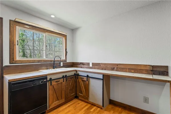 a white toilet sitting next to a bathroom sink