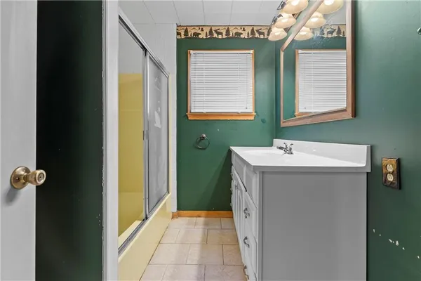 a view of a bathroom from a hallway
