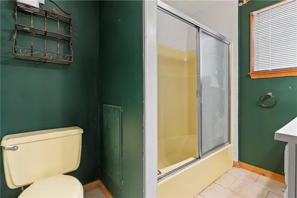 a view of staircase with white walls and a window