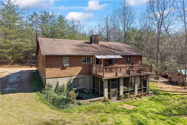 a large brick building with a large window and balcony