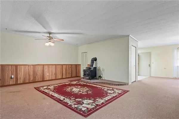 a view of a lush green hillside and houses