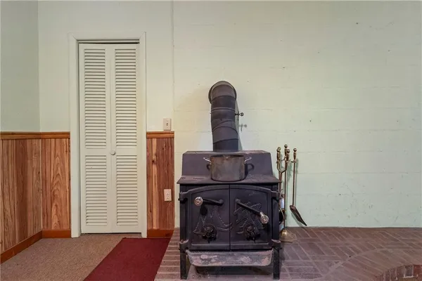 a view of a house with a mountain and trees