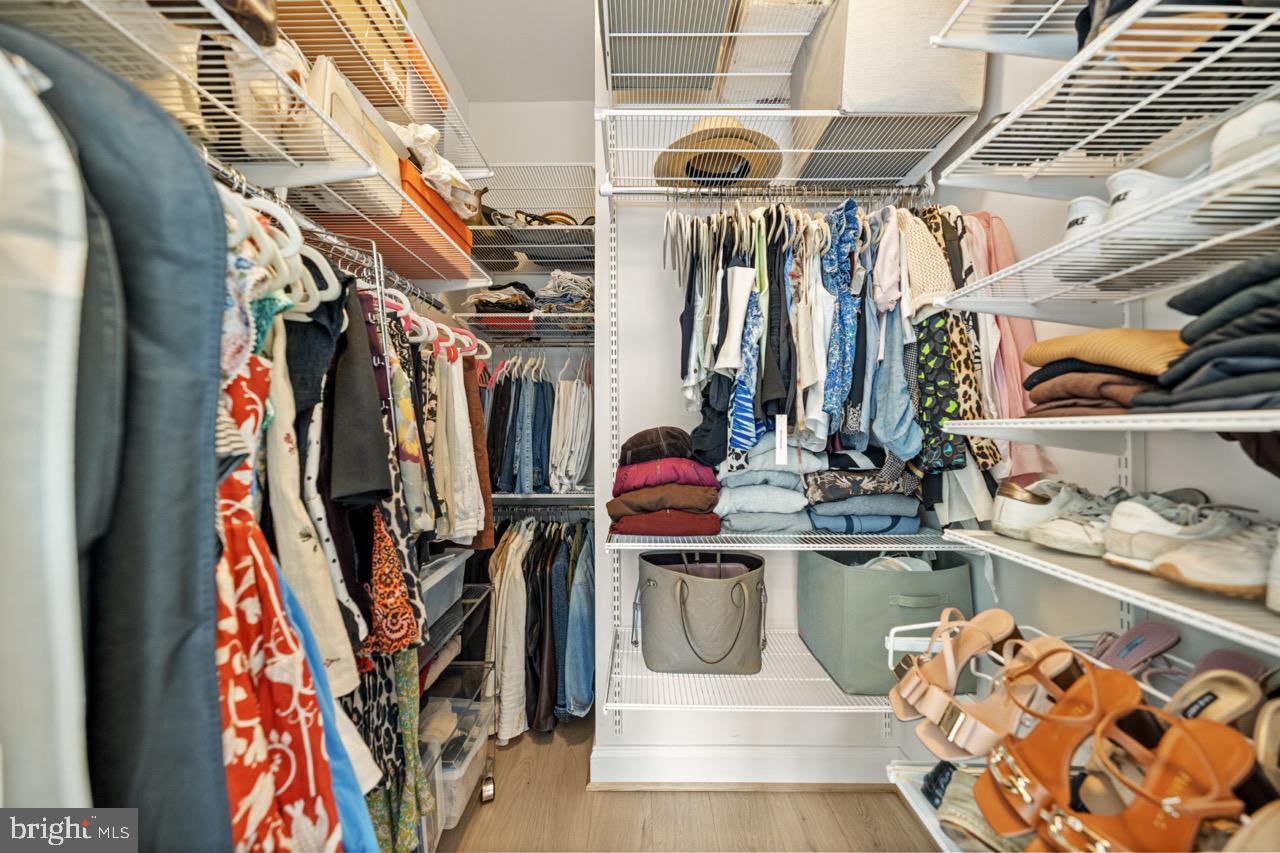 1210 R Street Northwest, Unit 213 Washington, DC 20009 - Photo 7 of 14 a view of walk in closet with clothes and shoes