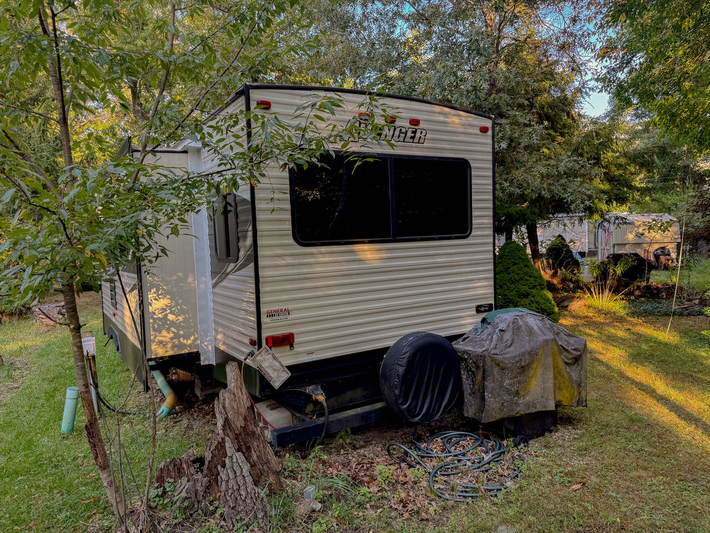 4-176 Woodhaven Sublette, IL 61367 - Photo 4 of 19 a view of a house with a bed and a table under an umbrella