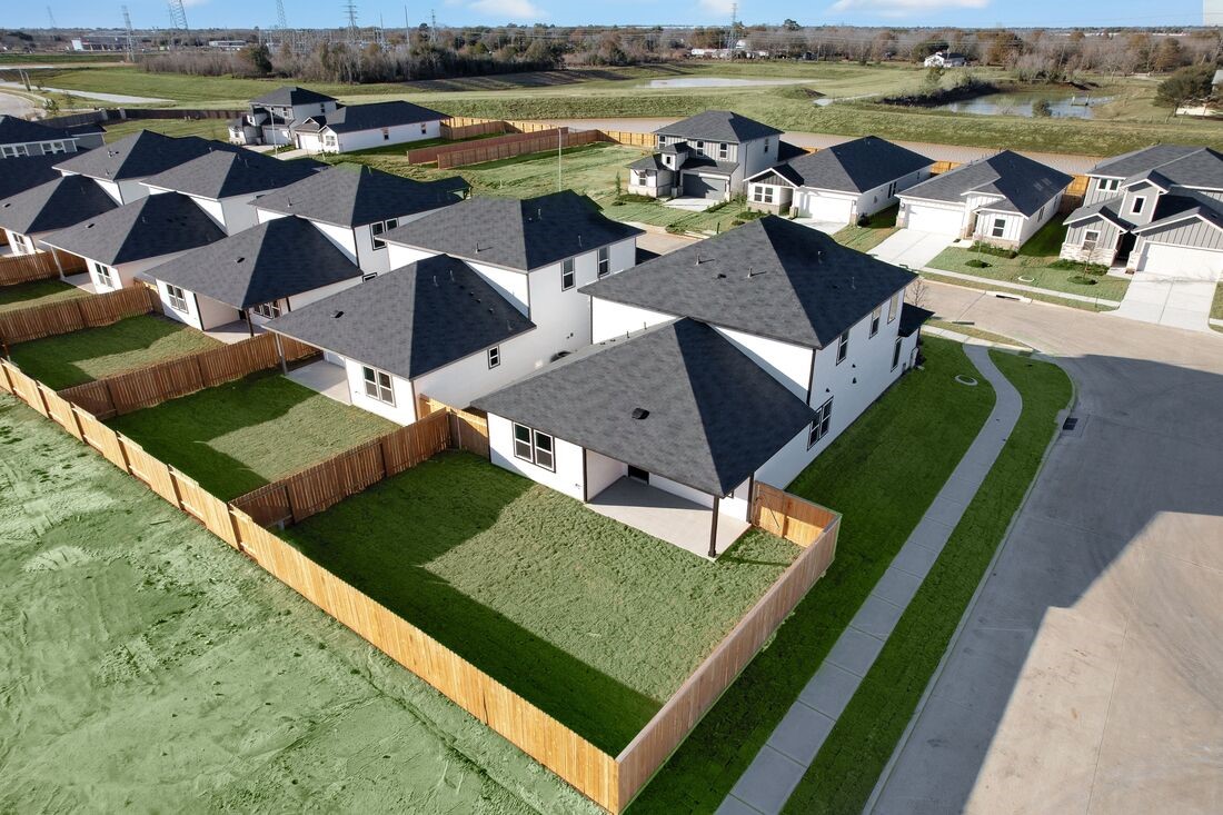 26703 Plain Glee Street Hockley, TX 77447 - Photo 29 of 34 an aerial view of a house with a garden and lake view