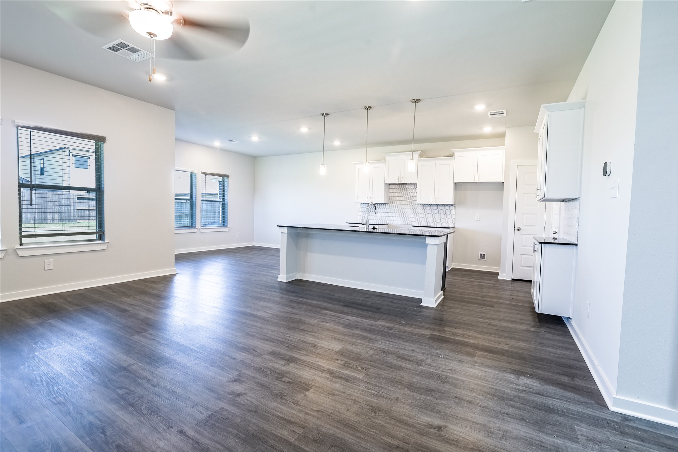 6426 Bolinas Court Rosharon, TX 77583 - Photo 12 of 49 a view of kitchen with wooden floor and window