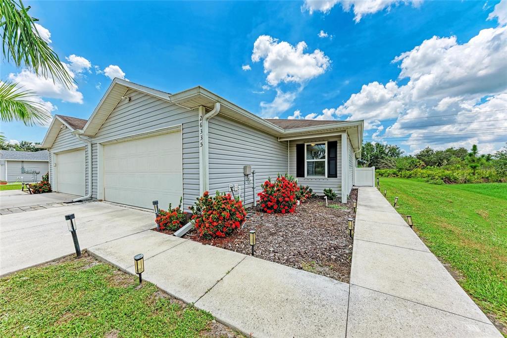 26335 Explorer Road Punta Gorda, FL 33983 - Photo 1 of 1 a front view of house with yard and entertaining space