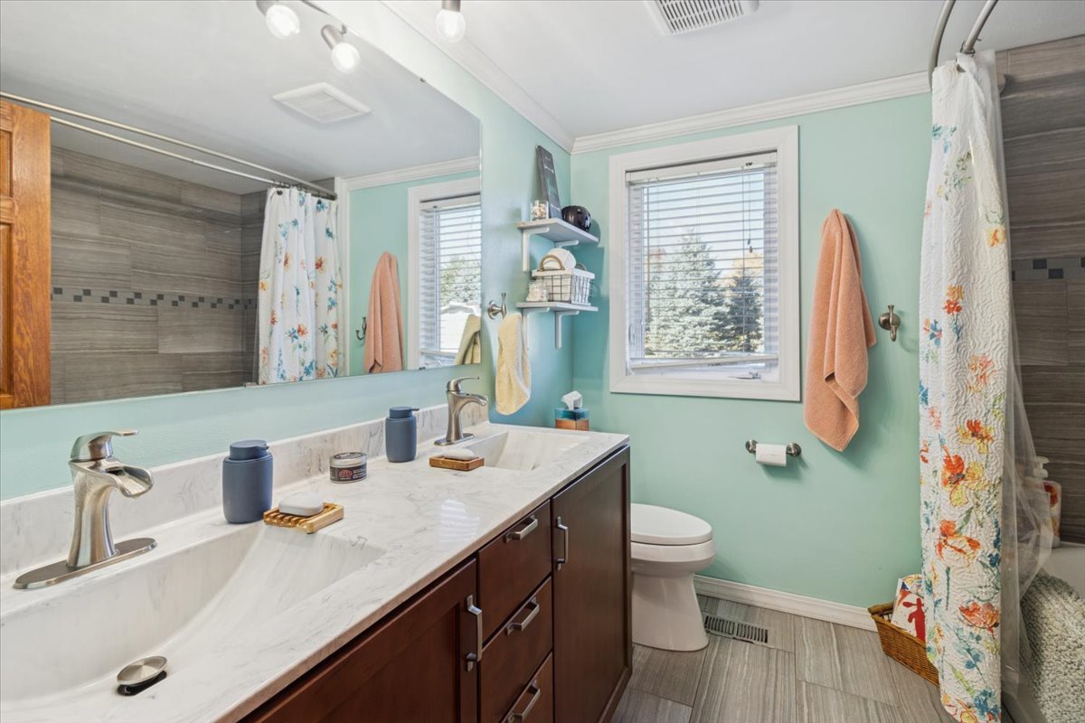 12641 Willow Lane Genoa, IL 60135 - Photo 16 of 29 a bathroom with a sink double vanity and a mirror