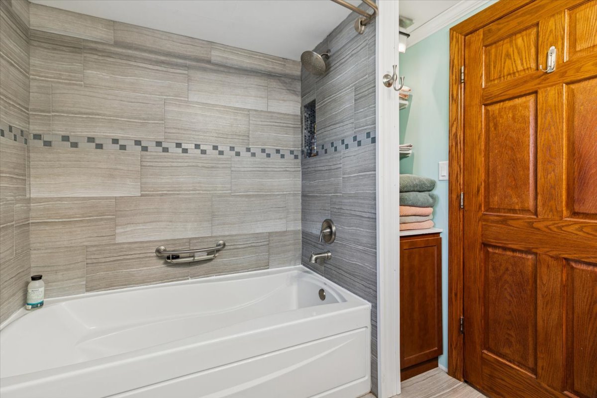 12641 Willow Lane Genoa, IL 60135 - Photo 17 of 29 a bathroom with a tub and shower