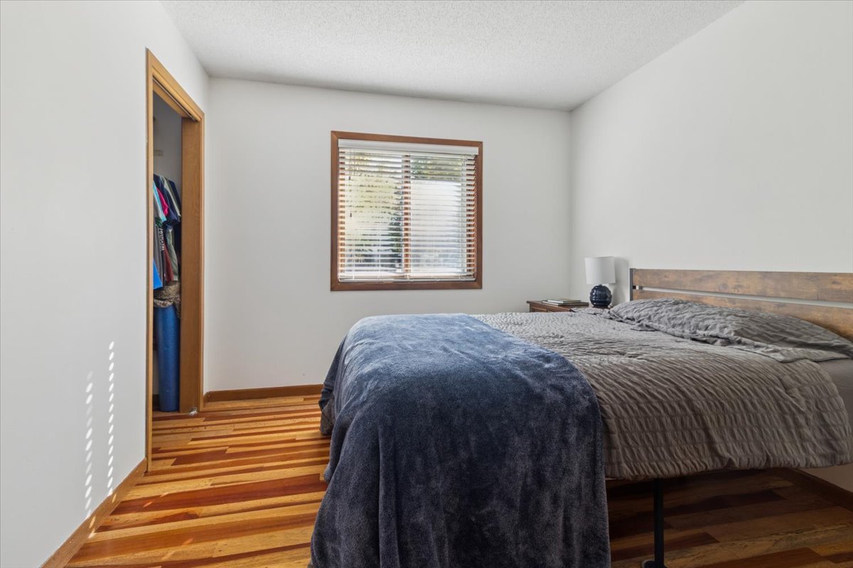 12641 Willow Lane Genoa, IL 60135 - Photo 19 of 29 a bedroom with a bed and a window