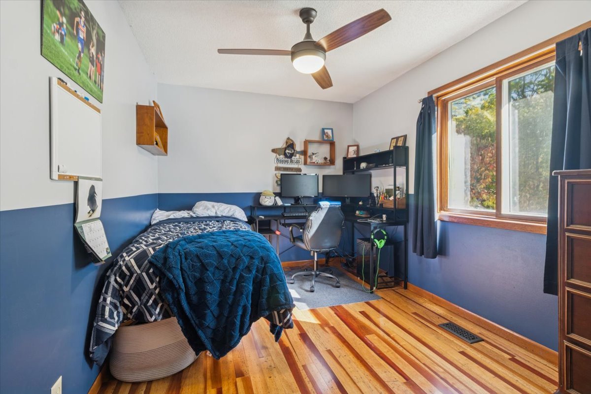 12641 Willow Lane Genoa, IL 60135 - Photo 20 of 29 a bed sitting in a bedroom next to a window