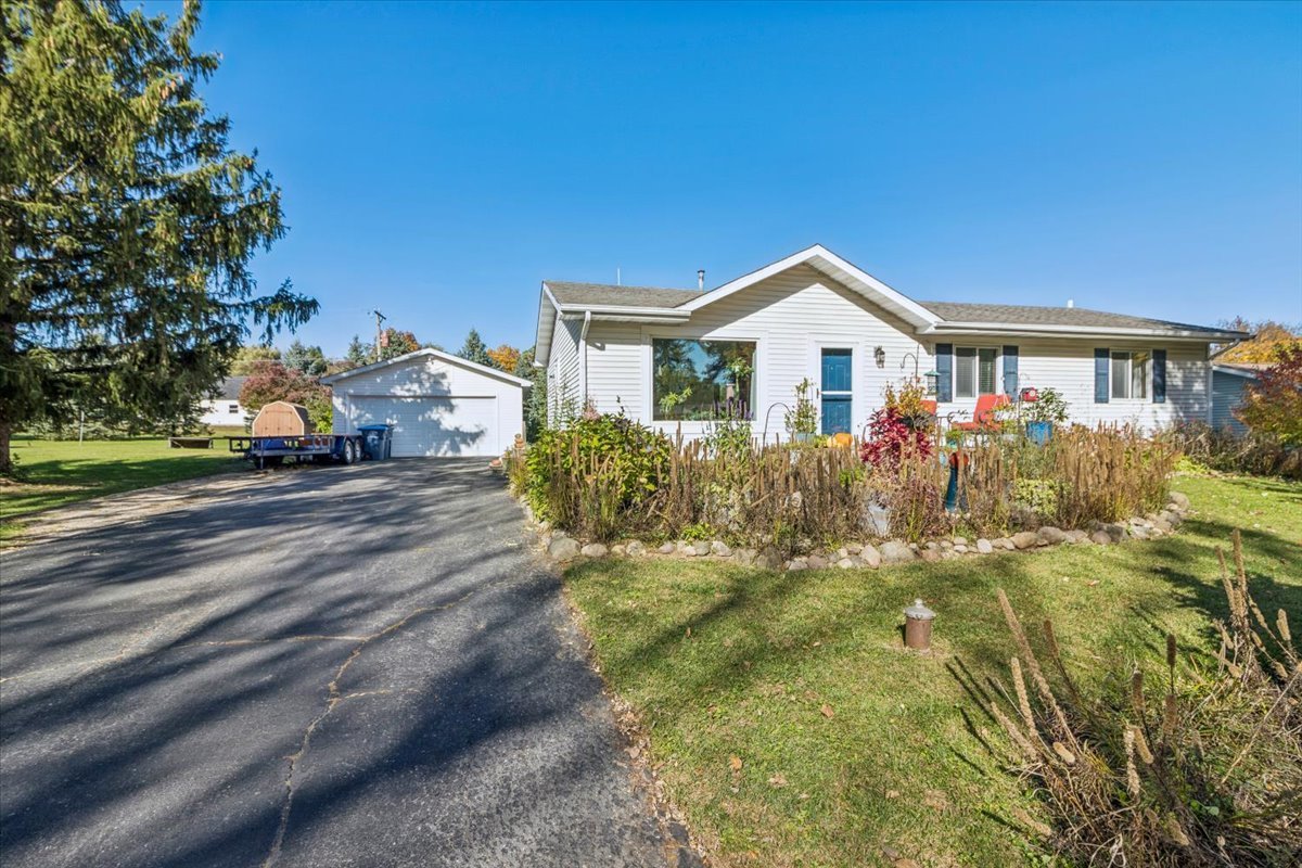 12641 Willow Lane Genoa, IL 60135 - Photo 2 of 29 a front view of a house with a yard