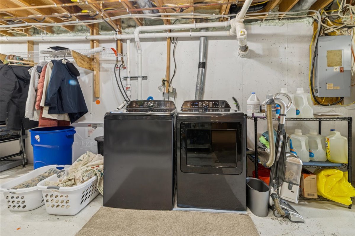 12641 Willow Lane Genoa, IL 60135 - Photo 24 of 29 a view of walk in closet with clothes and shoes