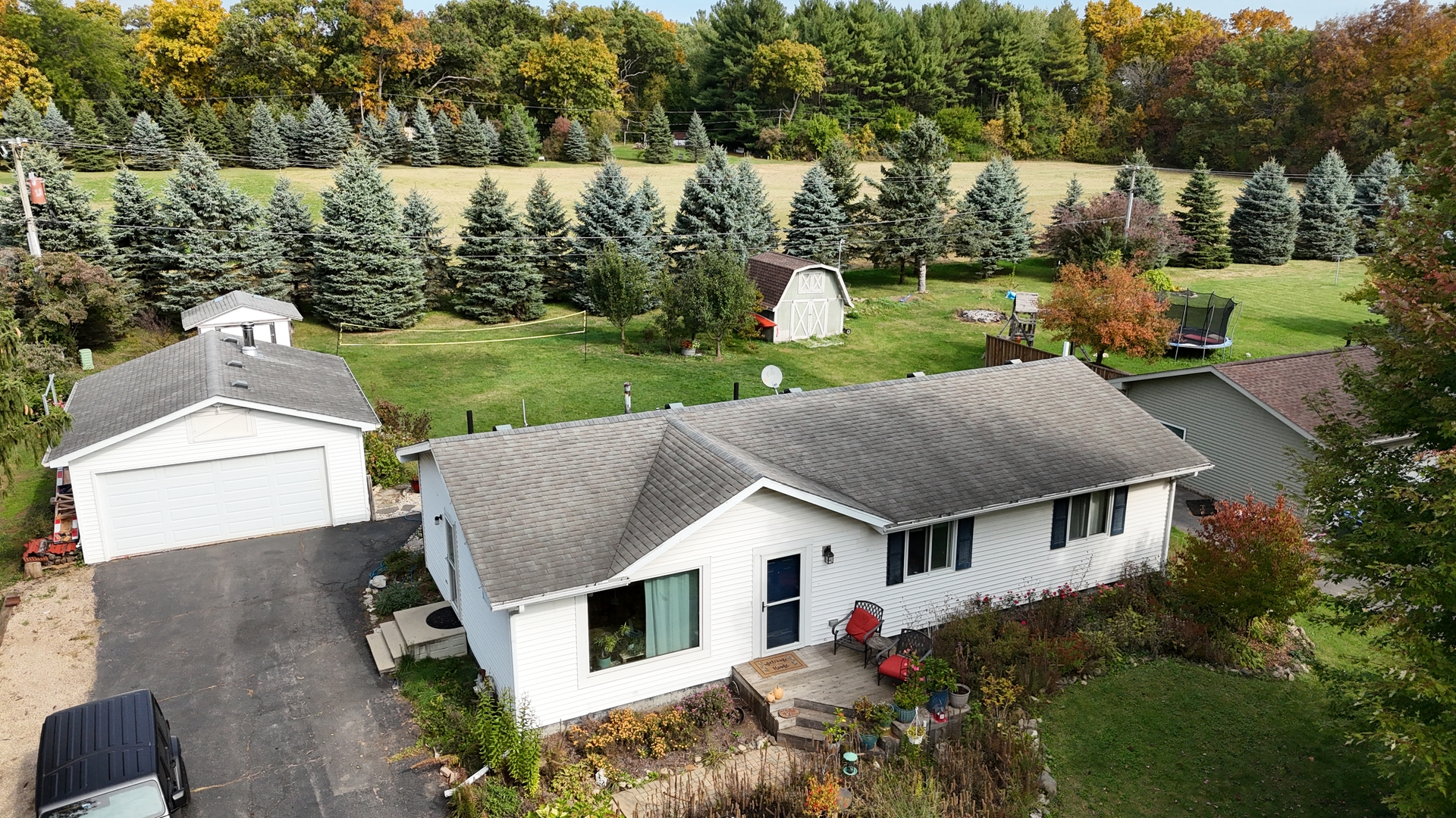 12641 Willow Lane Genoa, IL 60135 - Photo 4 of 29 a aerial view of a house with table and chairs next to a yard