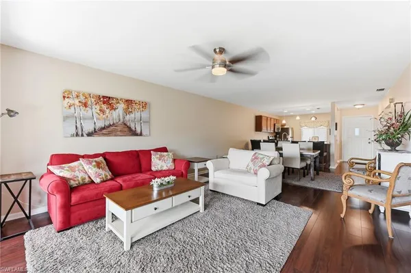 a living room with furniture or couch and a wooden floor