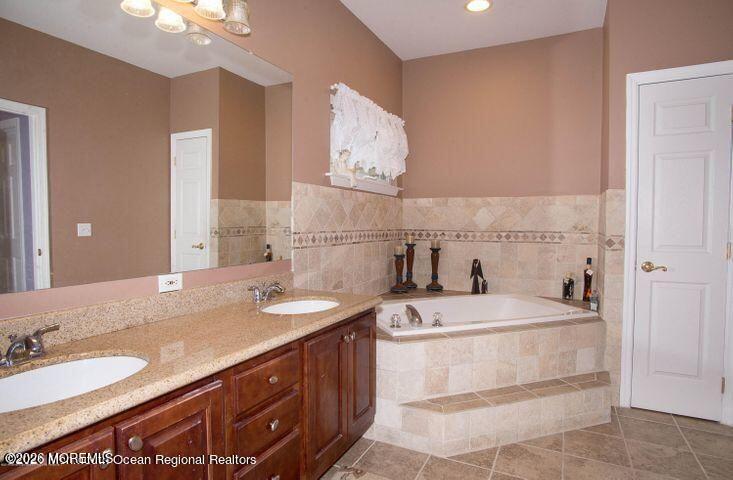 467 Leesville Road Jackson, NJ 08527 - Photo 12 of 19 a bathroom with a sink double vanity and a mirror