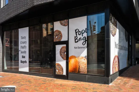 a store with outdoor seating area and retail shops