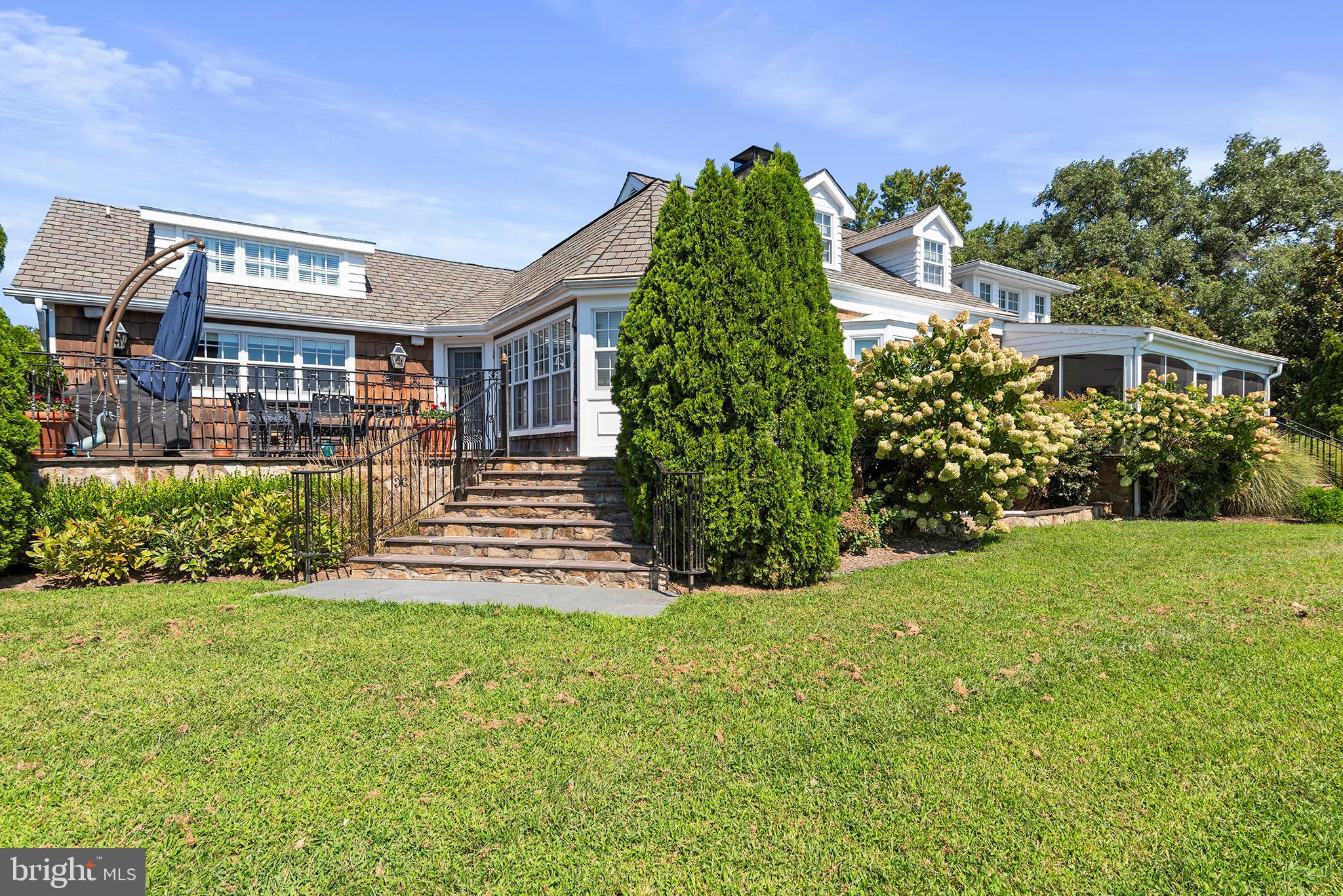 7989 Quaker Neck Road Chestertown, MD 21620 - Photo 12 of 90 a front view of a house with garden