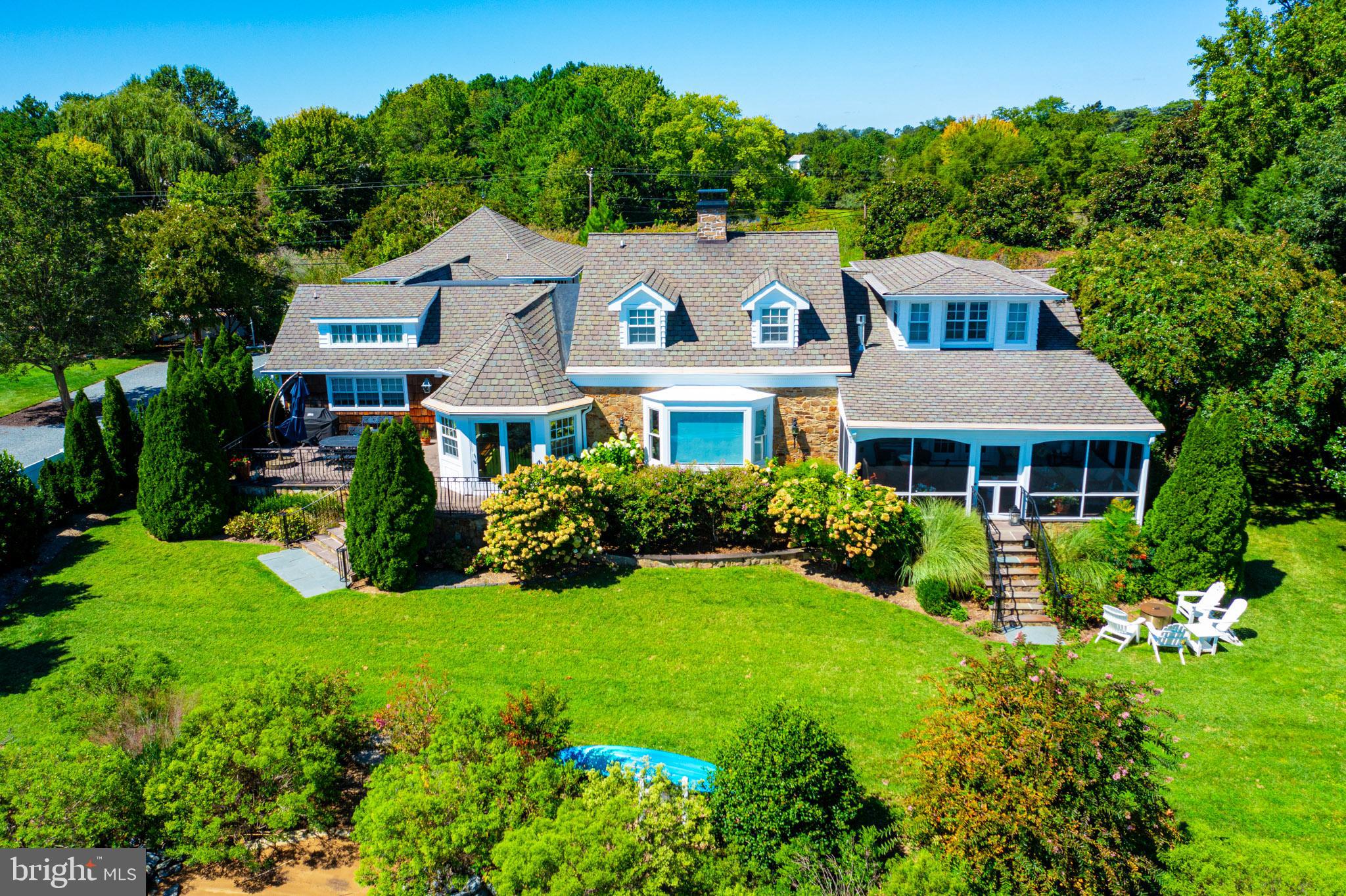 7989 Quaker Neck Road Chestertown, MD 21620 - Photo 19 of 90 a front view of a house with garden