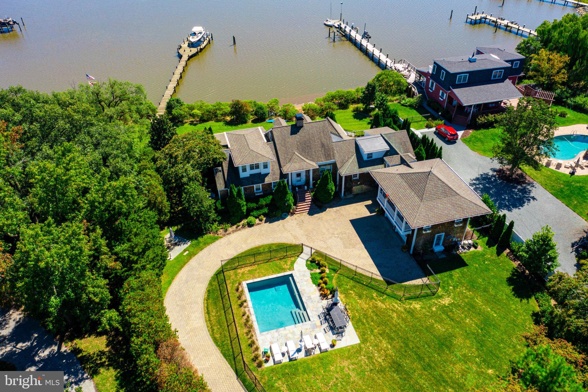 7989 Quaker Neck Road Chestertown, MD 21620 - Photo 2 of 90 an aerial view of house with a swimming pool outdoor seating and yard