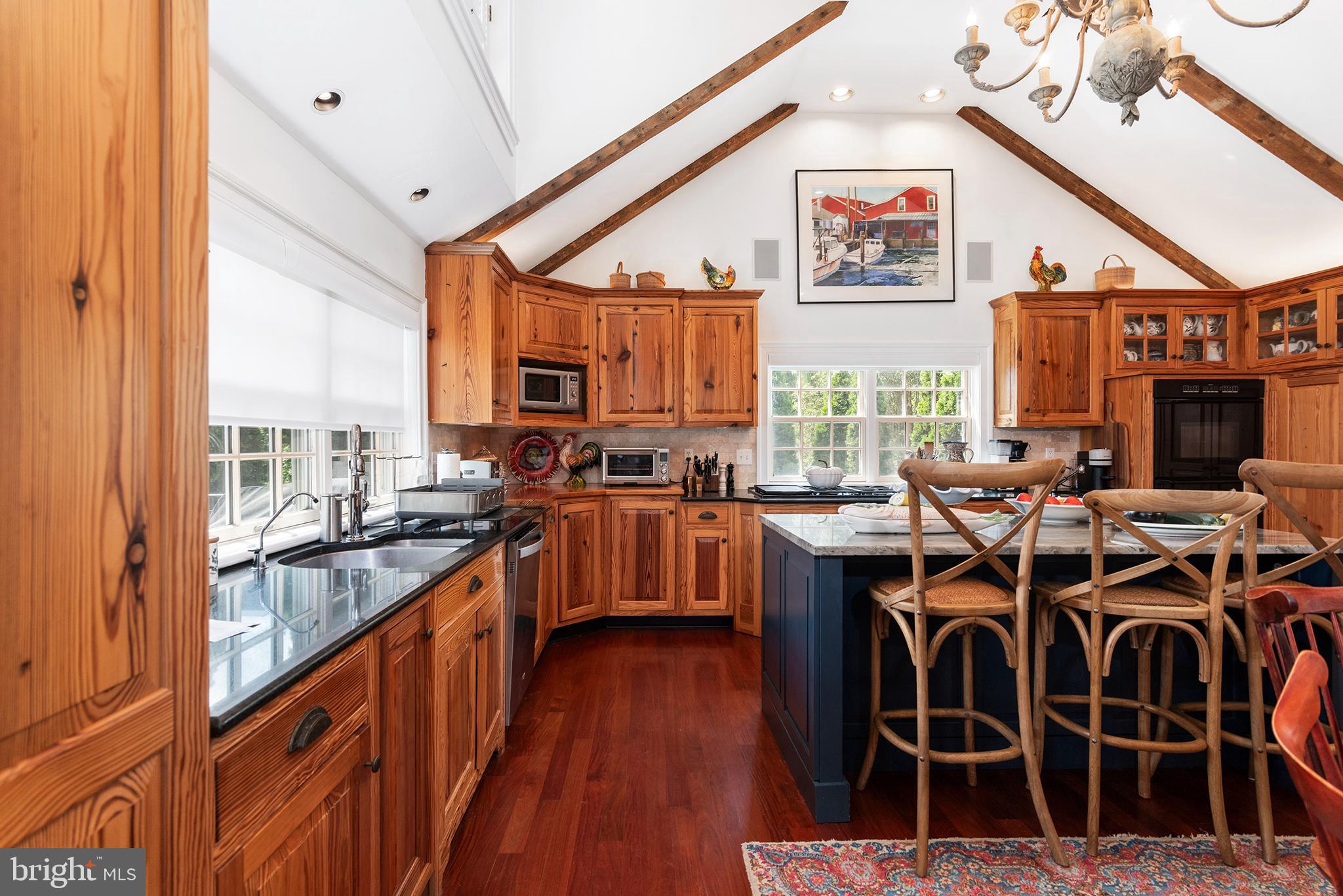 7989 Quaker Neck Road Chestertown, MD 21620 - Photo 22 of 90 a open kitchen with stainless steel appliances granite countertop a stove and a refrigerator