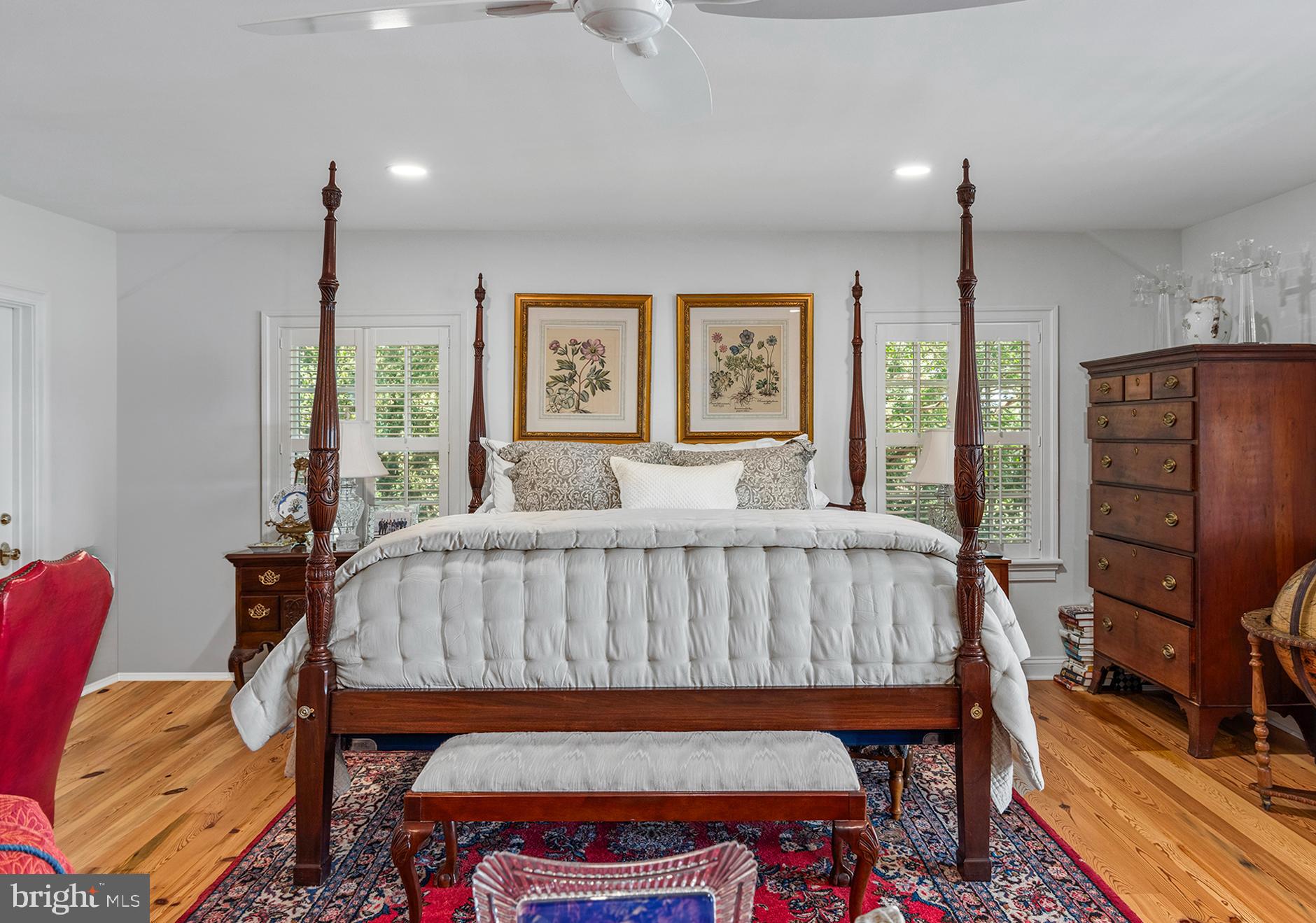 7989 Quaker Neck Road Chestertown, MD 21620 - Photo 27 of 90 a bed room with a bed and a chair