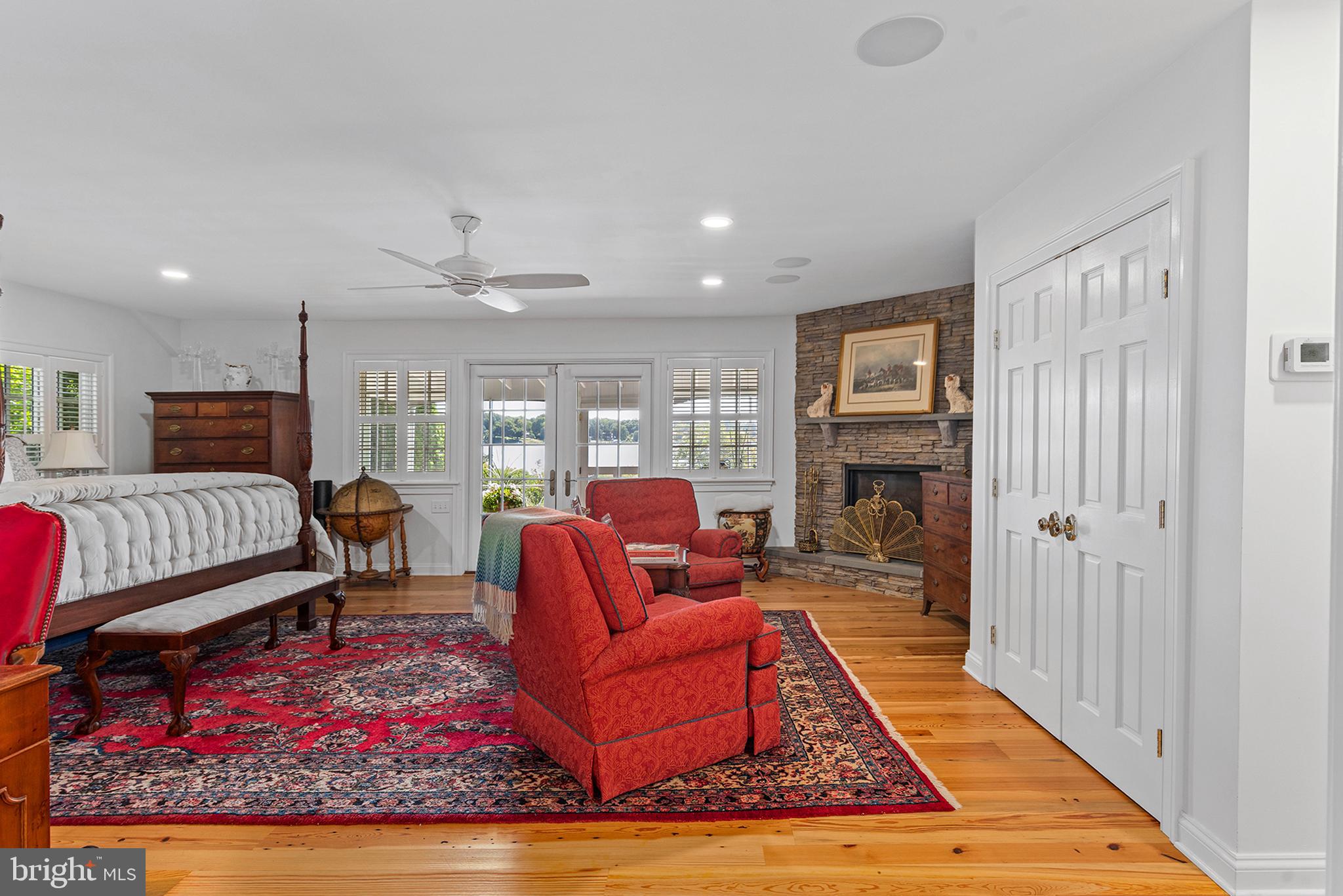 7989 Quaker Neck Road Chestertown, MD 21620 - Photo 28 of 90 a living room with furniture a rug and a fireplace