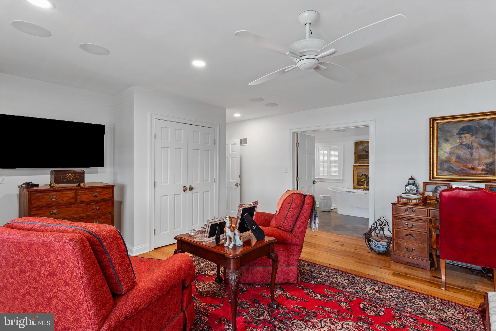 7989 Quaker Neck Road Chestertown, MD 21620 - Photo 30 of 90 a bedroom with furniture and a flat screen tv