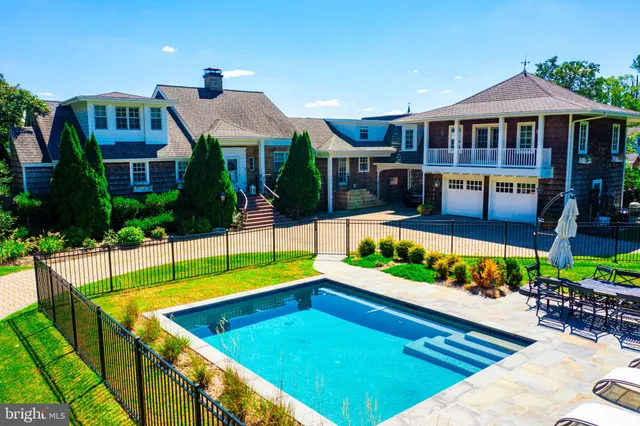 a front view of a house with swimming pool