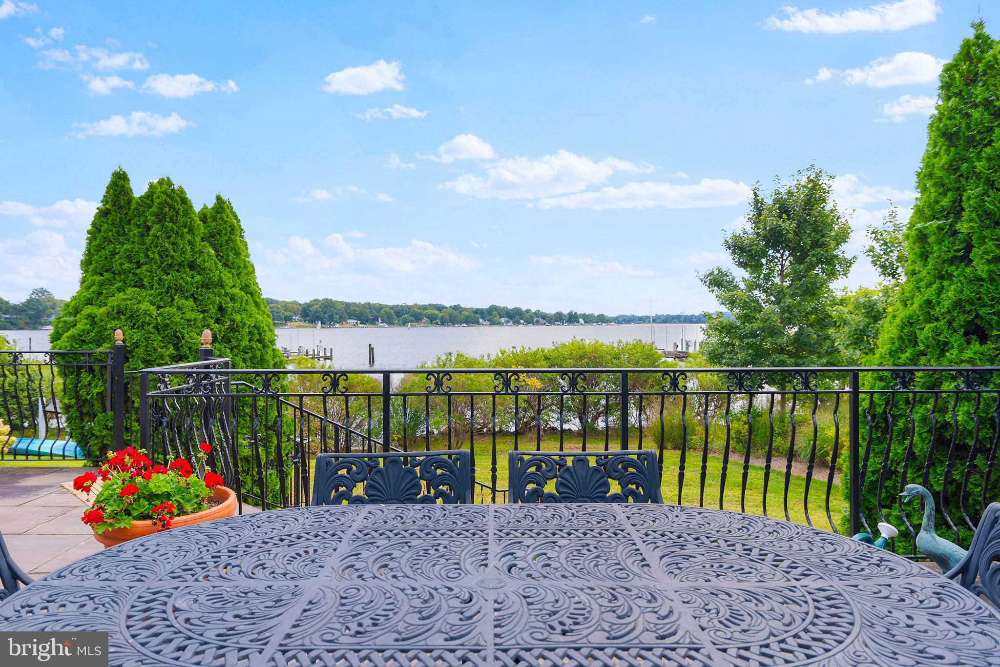 7989 Quaker Neck Road Chestertown, MD 21620 - Photo 38 of 90 a view of a lake with a building in the background