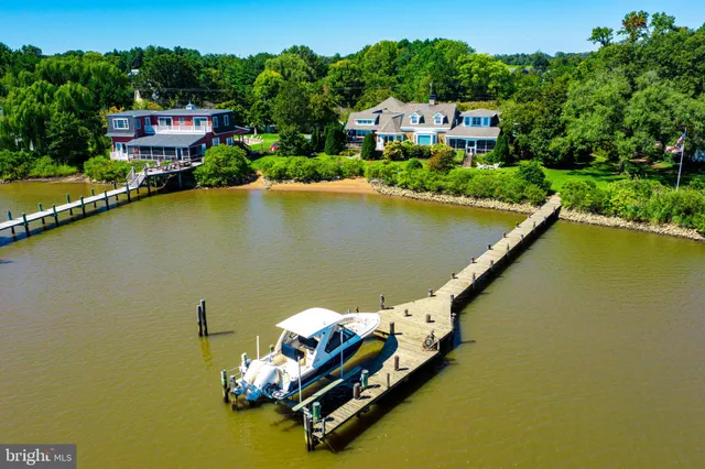 a view of a house with outdoor space and lake view