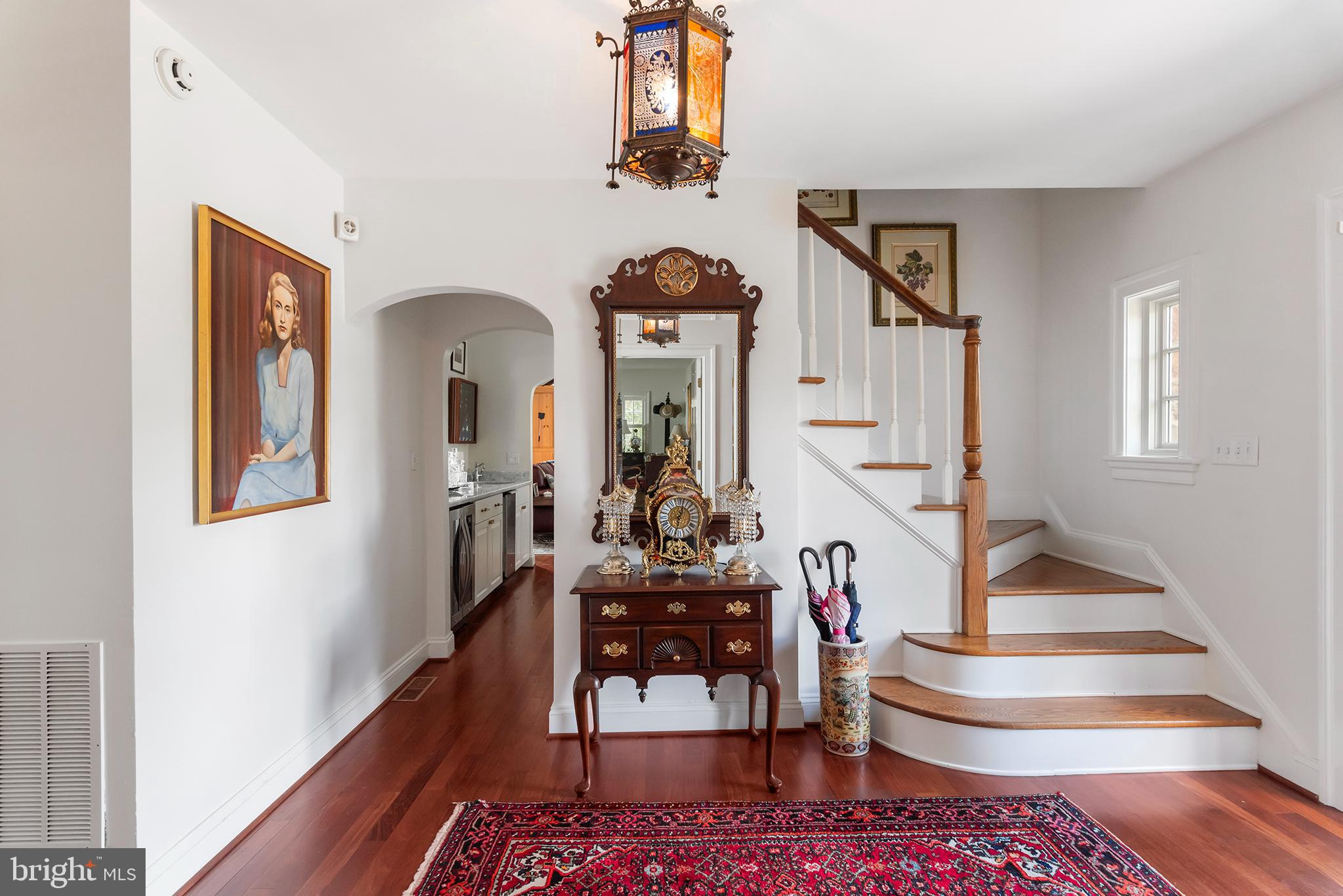 7989 Quaker Neck Road Chestertown, MD 21620 - Photo 47 of 90 a living room with couches and a dining table with wooden floor