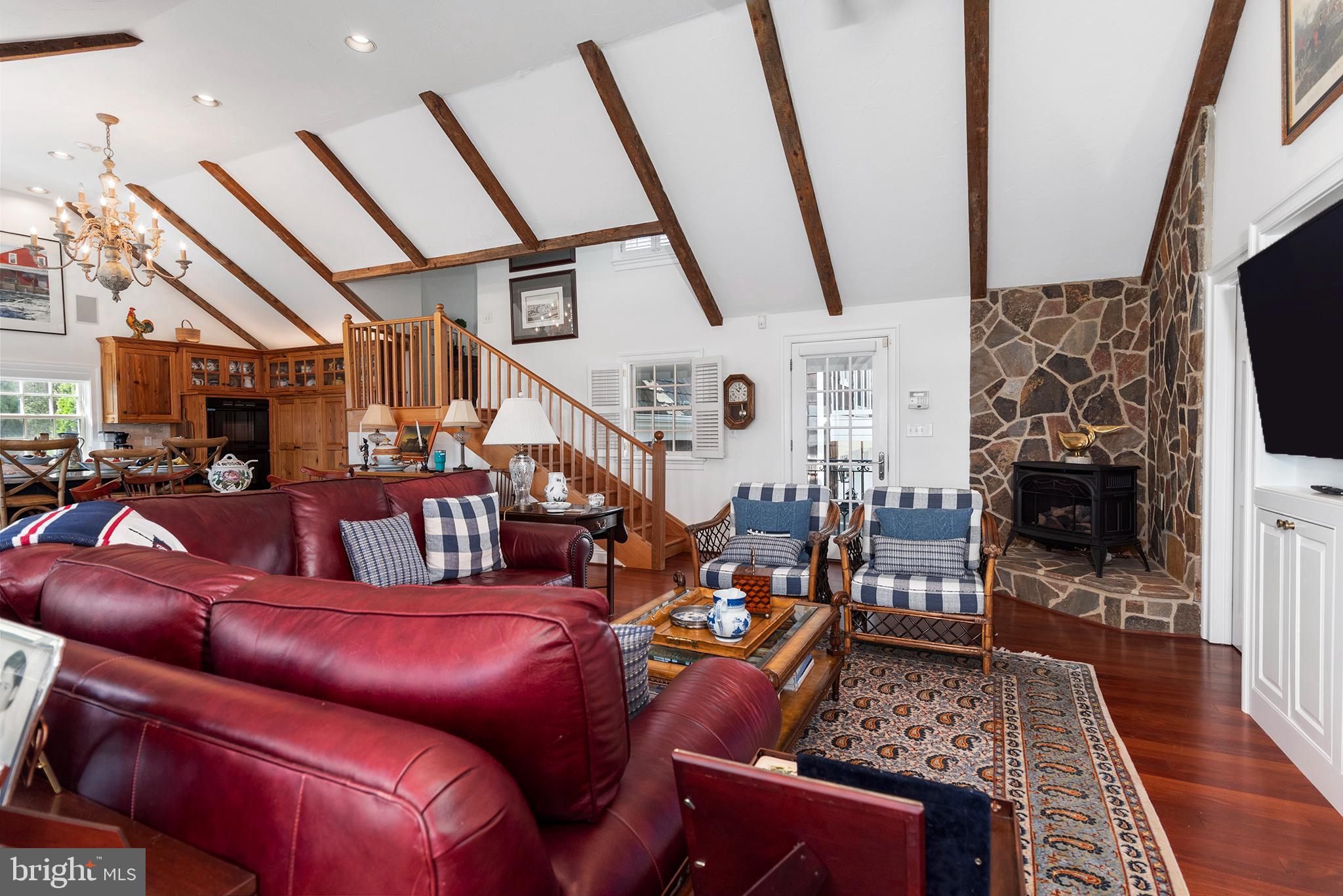 7989 Quaker Neck Road Chestertown, MD 21620 - Photo 50 of 90 a living room with lots of furniture and a flat screen tv