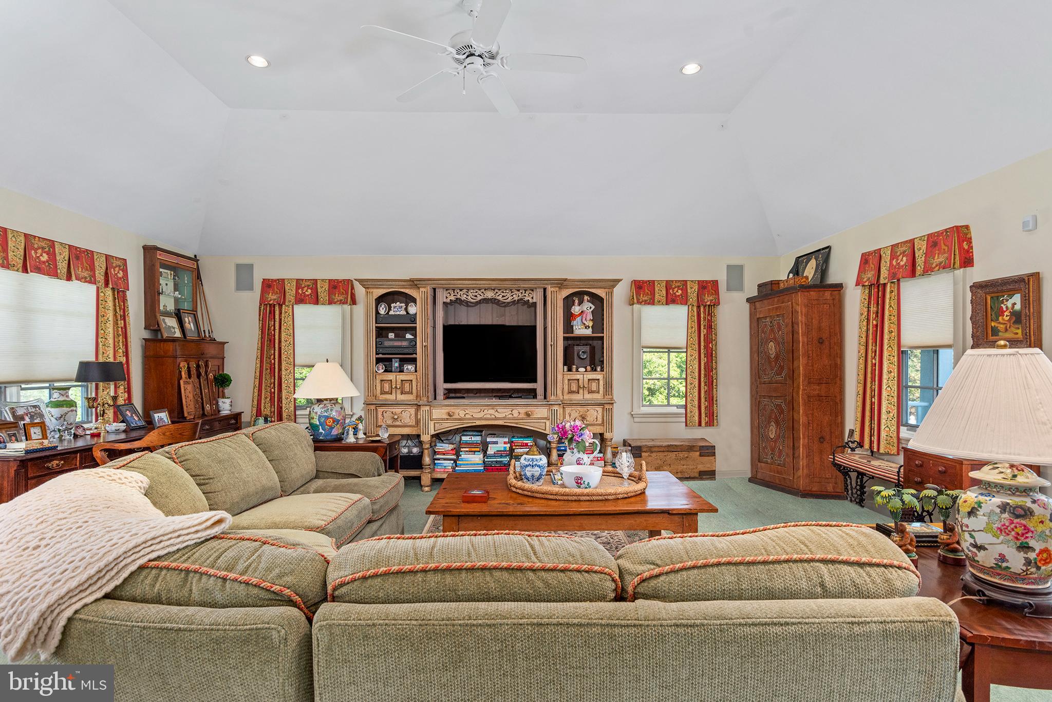 7989 Quaker Neck Road Chestertown, MD 21620 - Photo 80 of 90 a living room with furniture and a flat screen tv