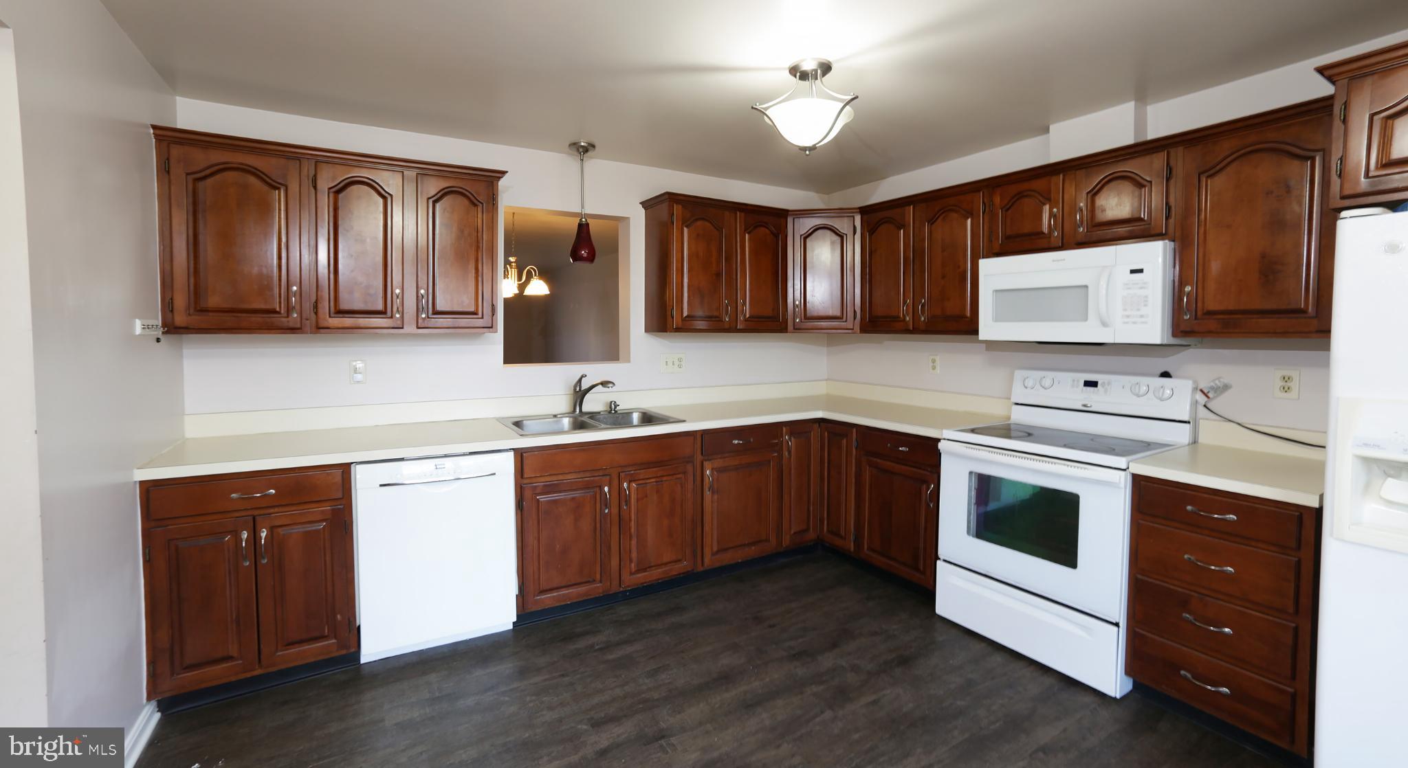 2017 C Raleigh Road Hummelstown, PA 17036 - Photo 11 of 36 Modern kitchen with rich wood cabinetry.