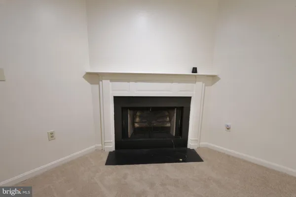 a living room with a fireplace