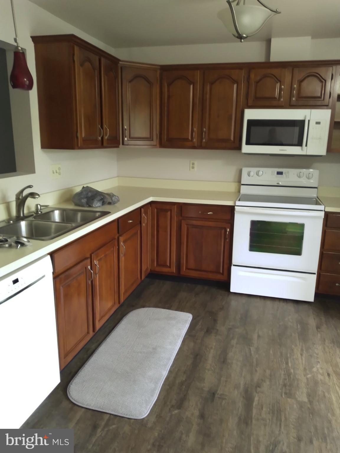 2017 C Raleigh Road Hummelstown, PA 17036 - Photo 5 of 13 Cozy kitchen with warm wooden cabinetry.