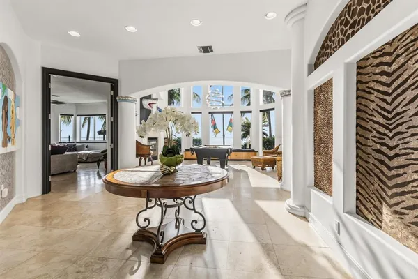 a living room with furniture a fireplace and decor