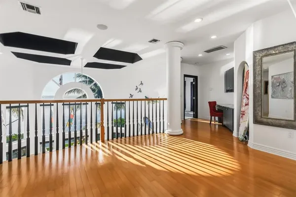 a bedroom with bed and large window