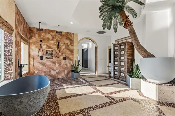 a bedroom with furniture and a window